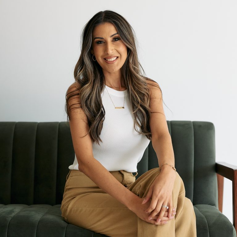Rienne Duran sitting on a sofa.
